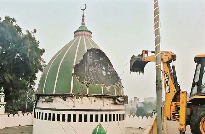 Photo of bulldozer action on the dome of the shrine